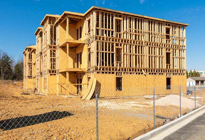 a temporary chain link fence in front of a building under construction, ensuring public safety in Granite Bay, CA